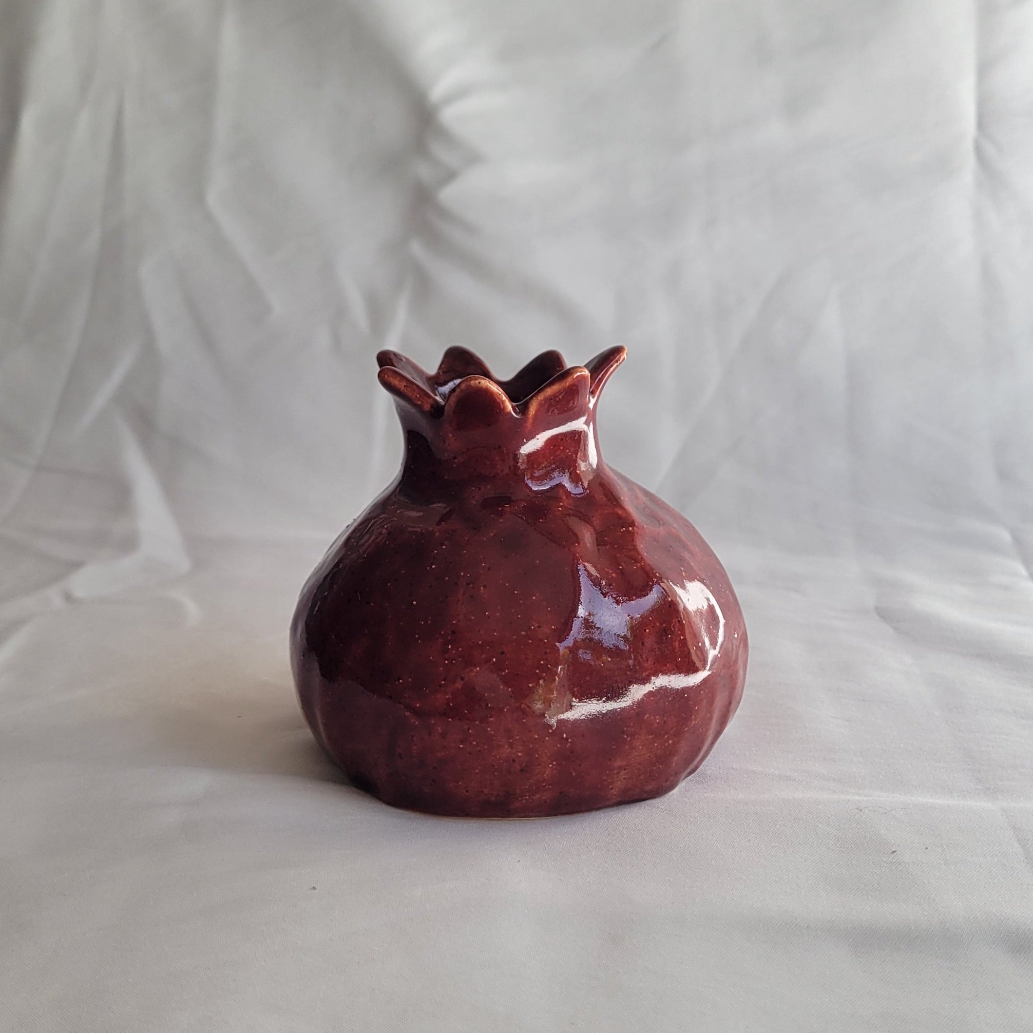 Pomegranate candle holder